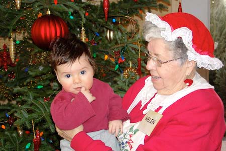 Mrs Claus holding baby