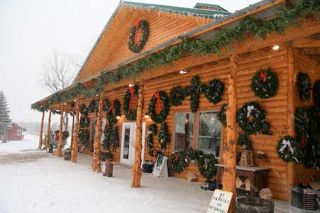 Snow falling in front of Christmas shop